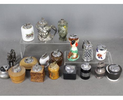 Tobacciana - A varied collection of table lighters to include novelty examples, glass, ceramic cased including Coalport and C