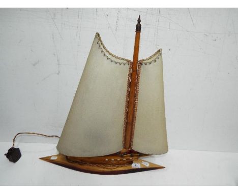 A vintage lamp in the form of a yacht, approx 54 cm 
