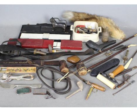 A box of mixed collectables to include sardine dish, black powder pouch / dispenser, fox tail, pair of hallmarked silver coff