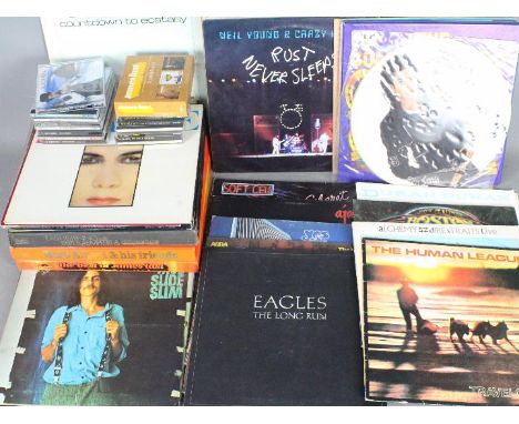 A collection of 12" vinyl records to include Soft Cell, Michael Jackson Bad (picture disc), Duran Duran, Boston, Dire Straits