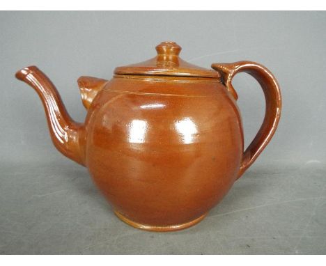 An Edwardian oversized salt glazed teapot, 24 cm (h) impressed mark British Made.