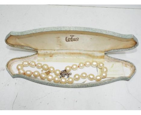 A set of Lotus pearls with silver clasp
