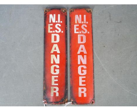 Two vintage enamel Danger signs for the Northern Ireland Electricity Service, approximately 30.5 cm x 7.5 cm. [2]