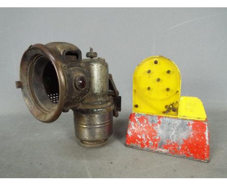 An early 20th century Powell &amp; Hanmer Revenge bicycle lamp and a DCMT Crescent money bank.