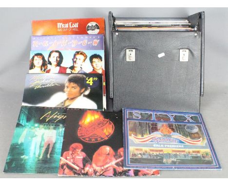 Approximately fifty 12" vinyl records to include Meat Loaf, Styx, Prefab Sprout, Poison, Michael Jackson, Level 42 and simila