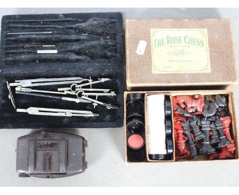 A vintage painted lead chess set The Rose, wit red and black pieces, contained in original box, king approximately 6.4 cm (h)