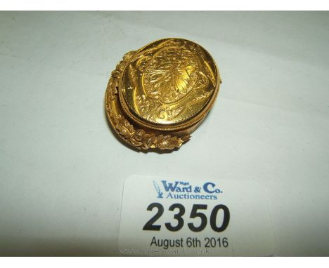 A pretty Gold Brooch, with the lid opening to reveal a portrait miniature of a small boy and the reverse aperture having a lo