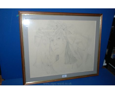 A framed Pencil Sketch of a young woman, 22" x 17".