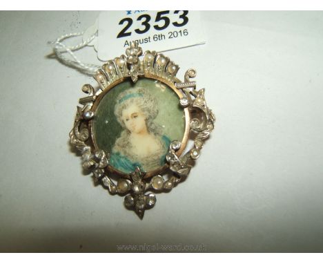 A pretty Gold and silver set, Diamond and seed pearl Brooch framing a portrait miniature.