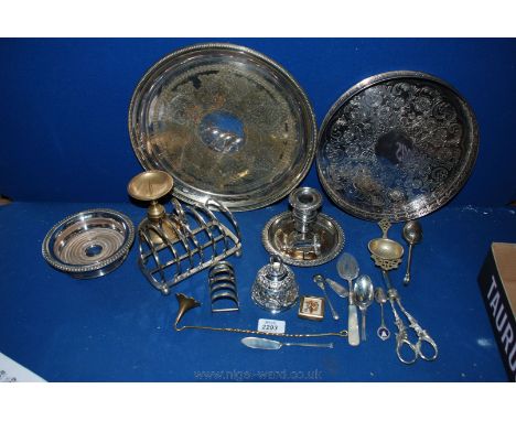 A quantity of silver plated items including tray, large toast rack, chamber stick, wine coaster, small toast rack, and pair o