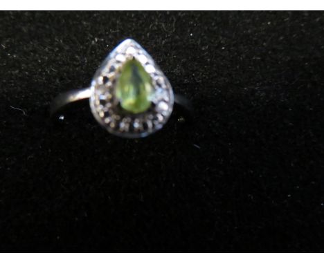 9ct White gold ring set with peridot stone surrounded by diamonds Size S