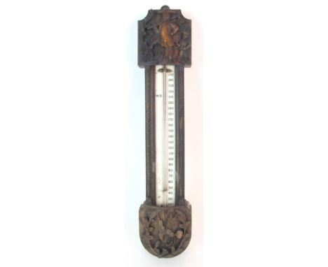 A Chinese padouk barometer the ceramic scale labelled Negretti and Zambra, Hatton Garden, Cornhill, London, the case carved w