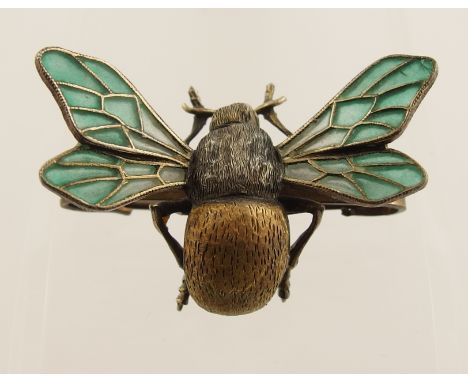 A German silver Art Nouveau bee brooch by Meyle & Mayer with plique a'jour enamel wings and a gilded abdomen textured with en