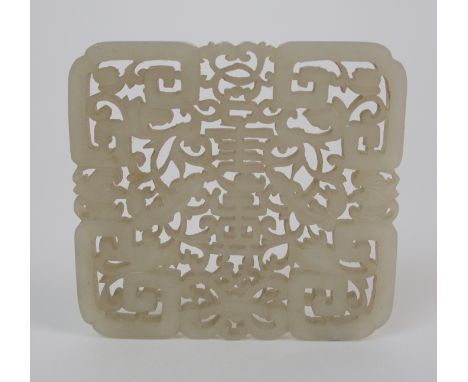 A Chinese jade rectangular pendant pierced and carved with shou characters, bats and scrolling foliage, 7 x 7.5cm