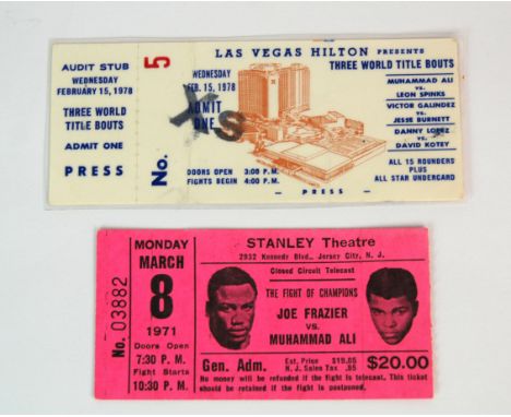 A Muhammad Ali v. Joe Frazier ticket stub, 8/3/71 and a Muhammad Ali v. Leon Spinks ticket stub, 15/2/78, stub laminated (2)