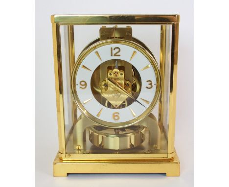 A Jaeger-LeCoultre Atmos Perpetuelle clock the circular chapter ring with applied gilt numerals and arrow hour markers, visib