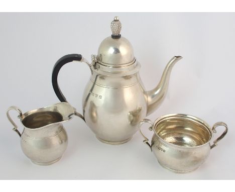 A three piece silver tea service by S. Blankansee & Sons Limited, Chester 1938, of plain baluster form, the hinged cover with