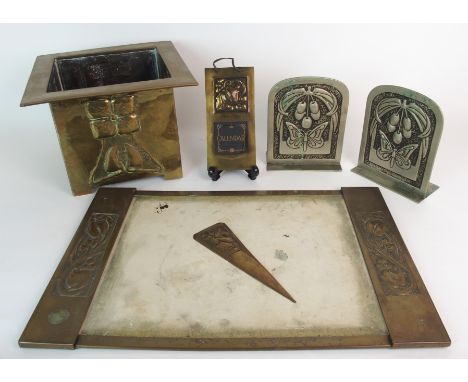 A group of Glasgow School Art Nouveau repousse work items a square section brass planter, each panel decorated with a stylise