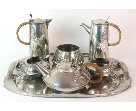 Archibald Knox for Liberty & Co. Tudric Pewter Tea and Coffee set, pattern 0231, circa 1905 comprising; a large twin handled 