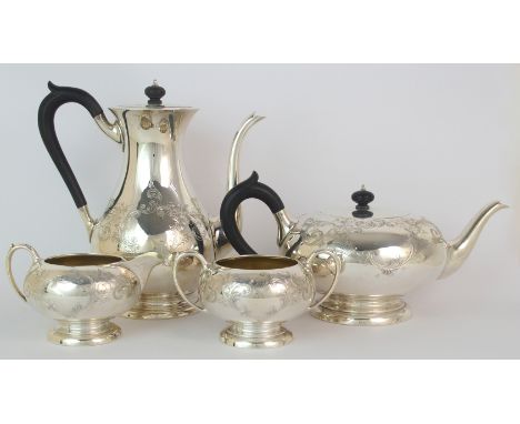 A four piece sterling silver tea and coffee service by Birks, of globular shape, the top half of the body with foliate engrav