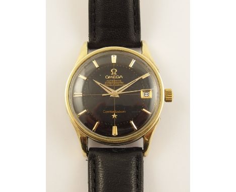An Omega constellation automatic Chronometer, black dial with date aperture gold coloured tapered hands and baton numerals wi