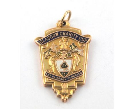 A 9ct gold and enamel 1937-38 Glasgow Charity Cup Winners medal the obverse inscribed Glasgow Charity Cup, the reverse inscri