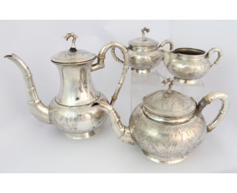 A Chinese sterling silver four-piece tea service by Wai Kee, Hong Kong, chased with bamboo and with faux bamboo handles, spou