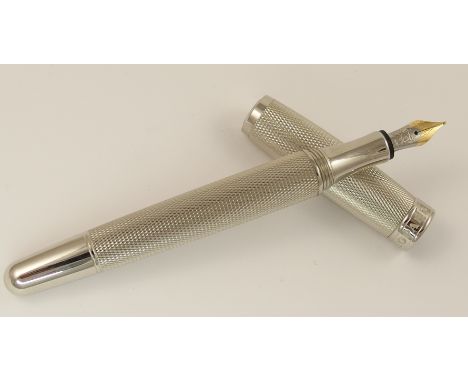 A Chopard pen palladium plated, with all over engine turned decoration, 18ct yellow and white gold nib, Chopard engraved in a