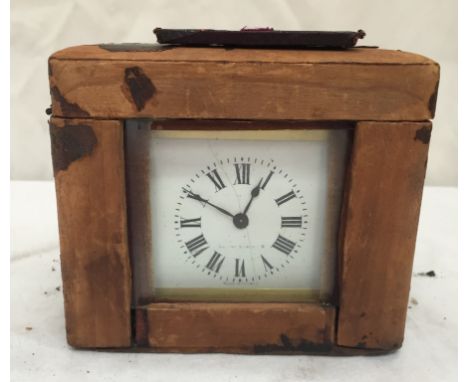 A French brass carriage clock in travelling case