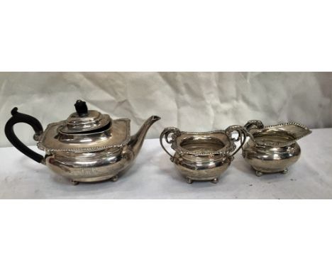 A silver three-piece bachelor's tea service
