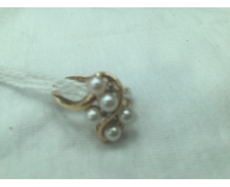 A 14ct pearl and diamond ring