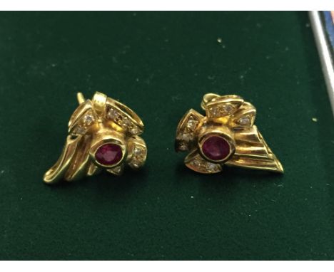 A pair of ruby and diamond earrings