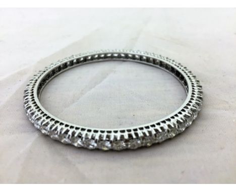 An 18ct white gold bangle set with 8ct of diamonds