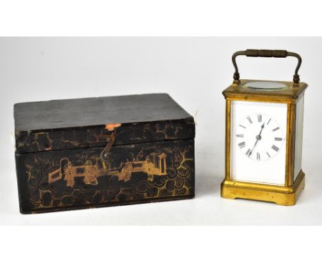 A late 19th/early 20th century French brass carriage clock, the white dial set with Roman numeral increments, four glazed pan