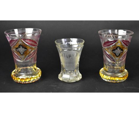 A near pair of 19th century Bohemian glass vases with ruby and amber glass overlay, each with central panel of flora and bask