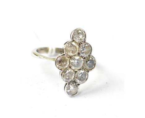 A 9ct white gold ladies' dress ring, the large marquise-shaped top facet set with nine white stones, size K, approx 2.9g.