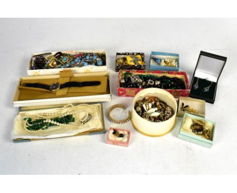 A quantity of vintage and contemporary costume jewellery to include bead necklaces, brooches, earrings, faux pearl necklace, 