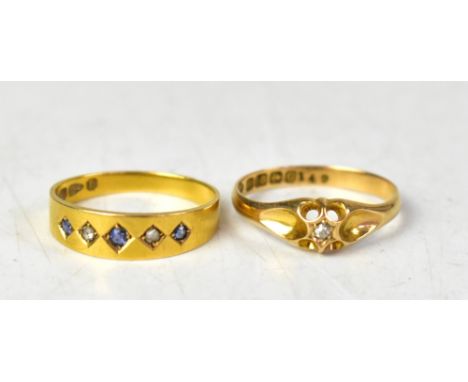 An 18ct yellow gold solitaire ring, the diamond set in an open work mount, size N1/2, and an 18ct yellow gold band ring set w