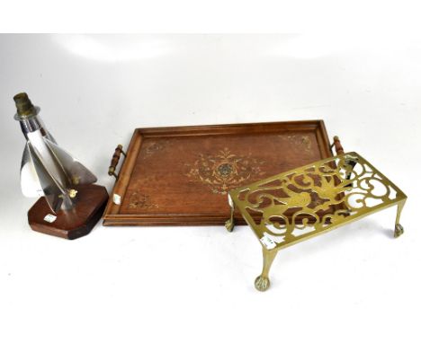 A 1940s oak wall clock, a pierced brass trivet, twin-handled tray and a lamp fashioned from a ship's log (4).