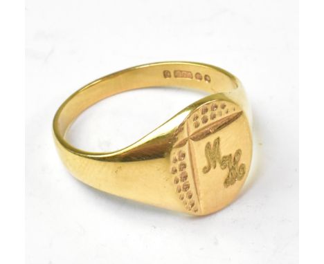 A 9ct gold vintage gentlemen's signet ring with oval head with partial textured design and initials 'MH', size X, approx 6g.