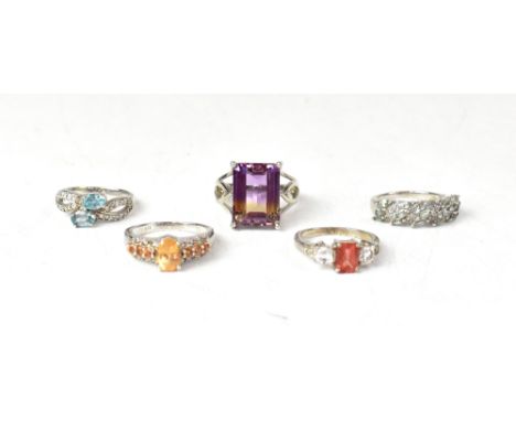 Five sterling silver rings, each set with different gemstones, comprising a claw set bi-colour ametrine on pierced decorative