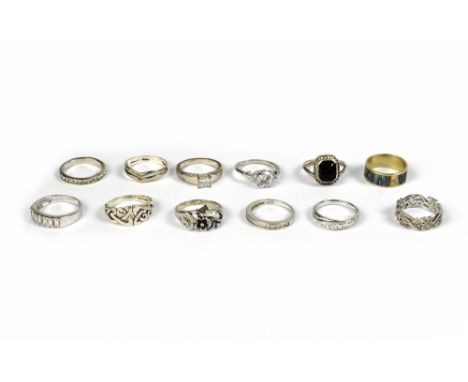 Twelve silver and silver plated rings of various designs, shapes and sizes, to include six examples marked '925', including a