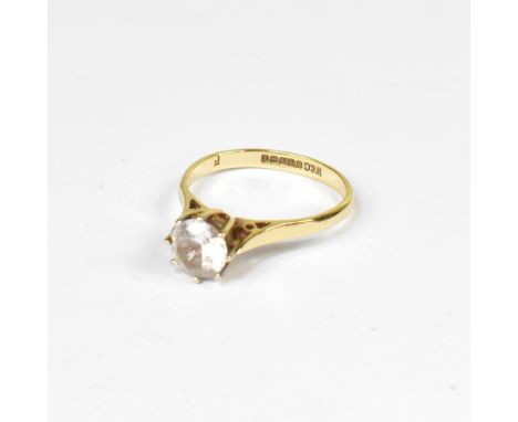 A 9ct gold solitaire ring with claw set white stone, on a 9ct yellow gold shank, size M, approx 2g. CONDITION REPORT The whit