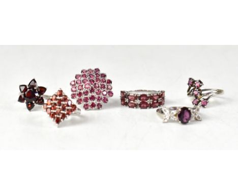 Six sterling silver garnet and topaz rings, comprising a contemporary-style rhodolite garnet five-stone crossover ring, appro