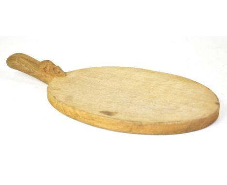 ROBERT MOUSEMAN THOMPSON OF KILBURN; a hand carved oak cheese board of oval form, with hand carved mouse to the handle, lengt