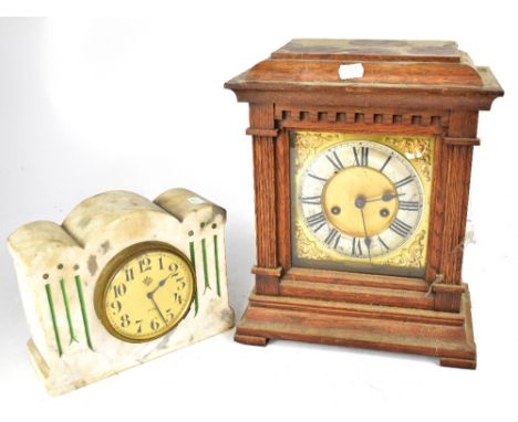 A c1900 oak mantel clock, the silvered dial set with Roman numerals and an Art Deco inspired mantel clock (2).