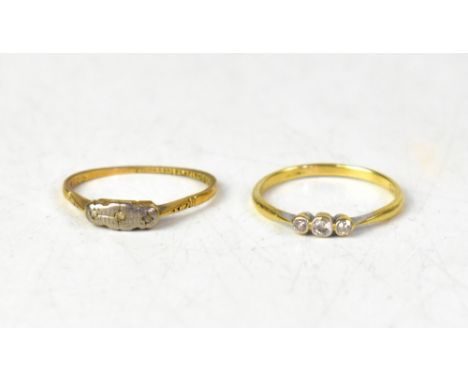 Two 18ct gold rings comprising one with a row of three small bezel set diamonds in platinum, on an 18ct gold shank, size U, a