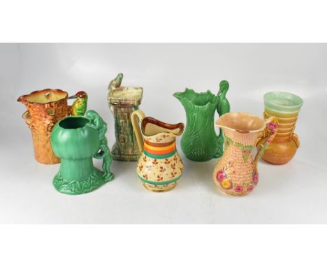 Various Art Deco hand painted and coloured jugs and vases, to include a Sylvac green jug with water lilies and crane, height 