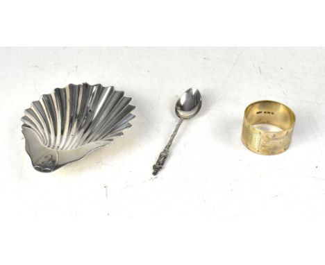 A Victorian hallmarked silver shell dish with raised shield initialled 'C' to the handle, on three conch shell feet, Goldsmit