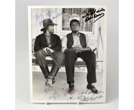 MUHAMMAD ALI; a black and white photograph bearing the boxing legend's signature, with further signature of Kris Kristofferso